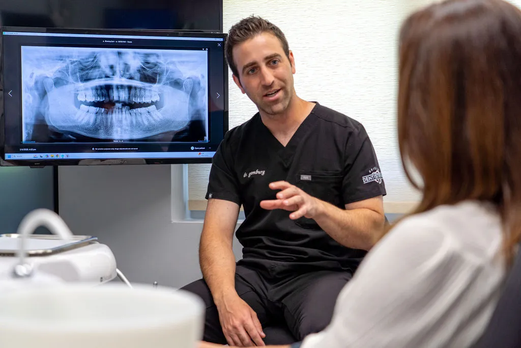 Dr. Gamburg discussing What is the Cost of Dental Implants and Implant Dentures Dr. Gamburg discussing What is the Cost of Dental Implants and Implant Dentures